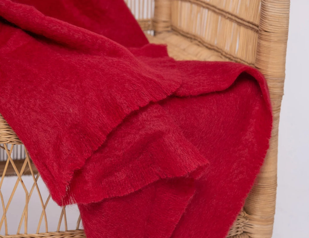 Ingubo Merlot blanket on a chair